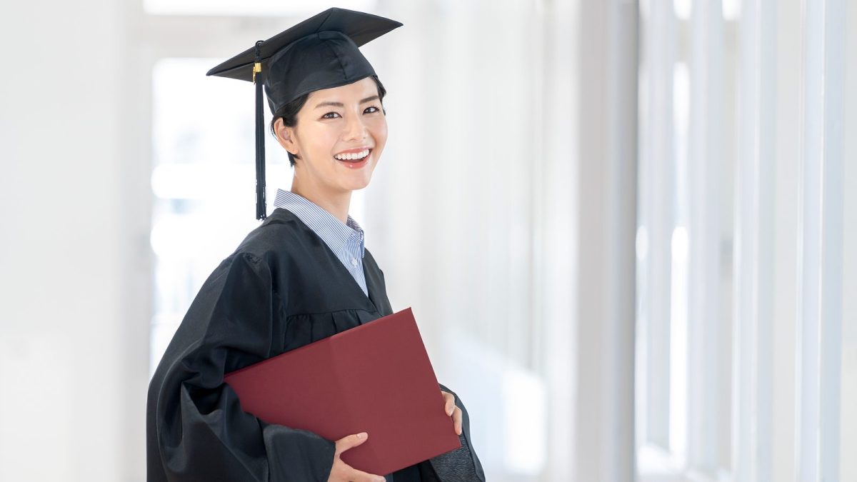 A woman wearing an academic cap