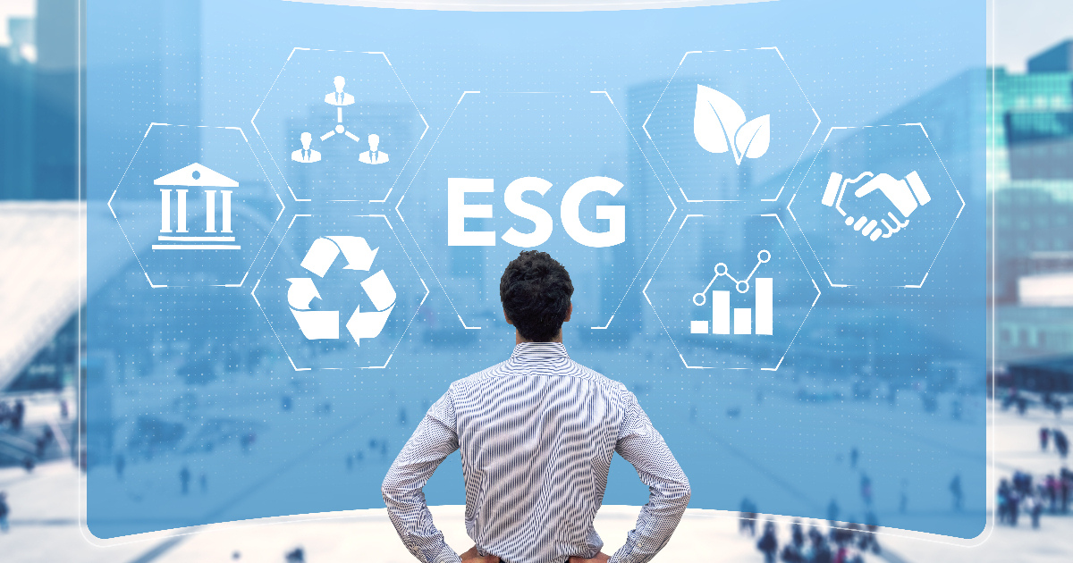 A man looking at a screen displaying ESG-related icons