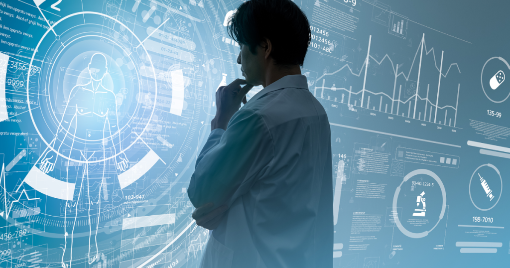 顎に手を当てて分析をする男性の後ろ姿